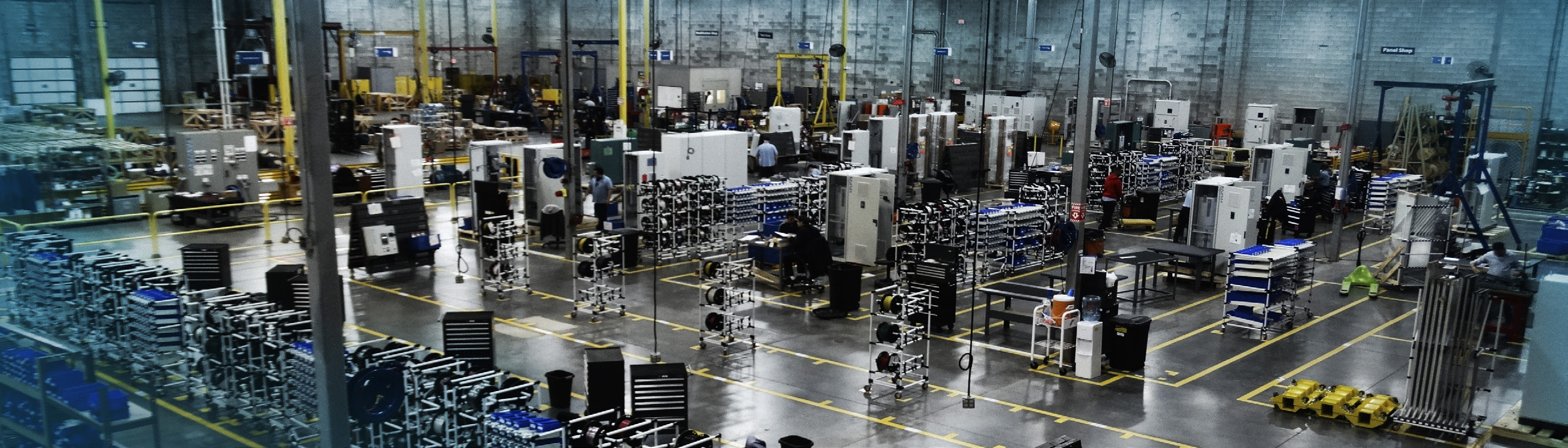 WEG panel workshop with variable speed drive cabinets under assembly