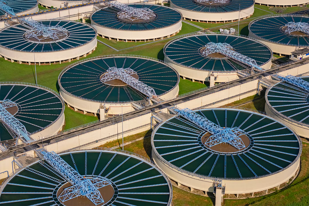Aerial view of circular clarifier basins at a large wastewater treatment plant