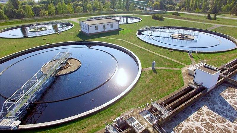 Aerial view of a wastewater treatment facility with circular basins